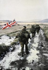 Royal Marines Yomp heading into Port Stanley with Paul Robinson as flag bearer.